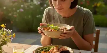 Mindful Eating 2026: Savor Food, Reduce Overeating by 10% Person mindfully enjoying a healthy meal, emphasizing sensory experience and conscious eating.