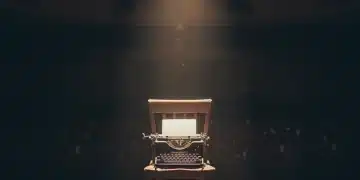 Discover Emerging American Playwrights: Insider Tips & Future Stars Spotlight on a stage with a typewriter, symbolizing emerging American playwrights.