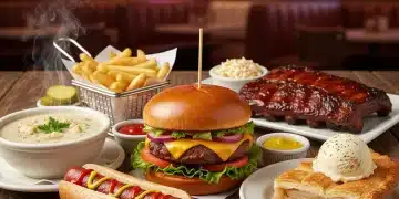 A diverse spread of iconic American comfort foods, including burgers, apple pie, and clam chowder, ready to be enjoyed.